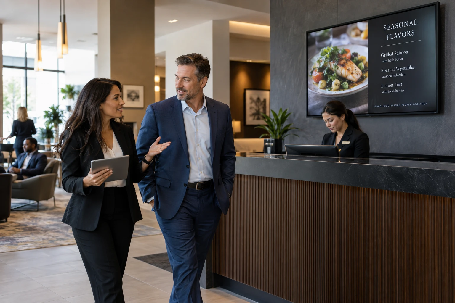 Sales colleagues reviewing a signage opportunity at a commercial site.